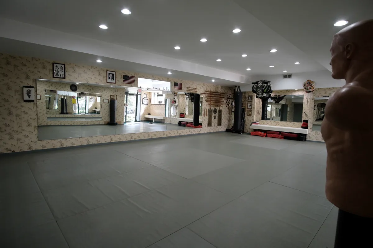 The dojo with mats and training equipment