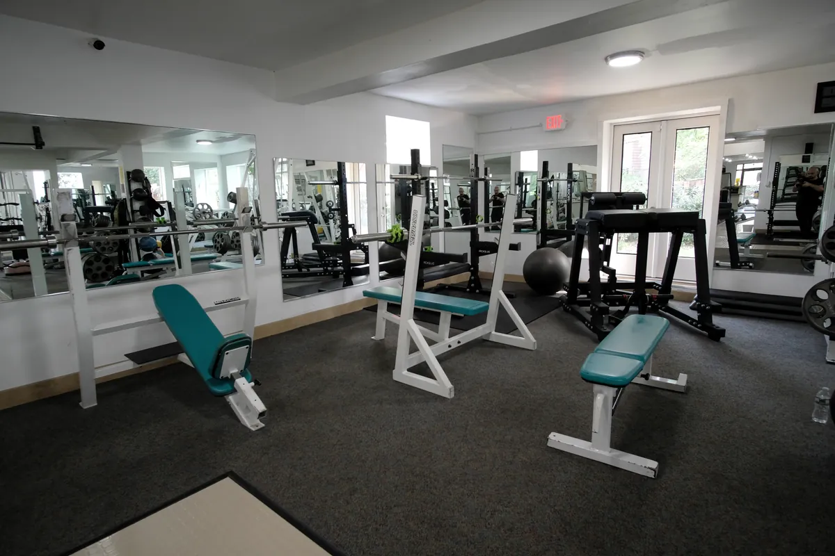 Benches, racks and free weights on the ground floor