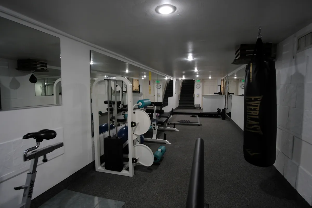 The lower level with a heavy bag, bike and cable station
